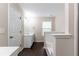 Bathroom featuring a tiled tub-shower and single sink vanity with dark wood floors at 1646 Sandy Beach Pt, Lawrenceville, GA 30043