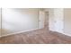 Bedroom features neutral carpeting, a large closet, and natural light at 1646 Sandy Beach Pt, Lawrenceville, GA 30043