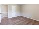 An additional bedroom offers soft carpeting and access to the upper level at 1646 Sandy Beach Pt, Lawrenceville, GA 30043