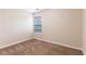 Cozy bedroom with plush carpet and a bright window at 1646 Sandy Beach Pt, Lawrenceville, GA 30043
