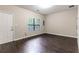 Versatile bonus room with hardwood floors, a window, and neutral paint, perfect for a home office at 1646 Sandy Beach Pt, Lawrenceville, GA 30043