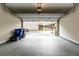 Spacious two-car garage with an open door and ample storage space, ready for your vehicles at 1646 Sandy Beach Pt, Lawrenceville, GA 30043
