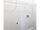 Functional laundry area with washer/dryer hookups and shelving for organized storage solutions at 1646 Sandy Beach Pt, Lawrenceville, GA 30043