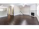 Spacious living room featuring hardwood floors, fireplace and stairway at 1646 Sandy Beach Pt, Lawrenceville, GA 30043