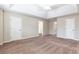 Large main bedroom featuring carpet and multiple entry points to adjoining rooms at 1646 Sandy Beach Pt, Lawrenceville, GA 30043