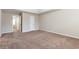 Large main bedroom featuring carpet floors and multiple white doors and trim at 1646 Sandy Beach Pt, Lawrenceville, GA 30043