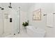Spa bathroom featuring a modern tub, a frameless shower and decorative tile at 2133 Trailwood Rd, Decatur, GA 30032