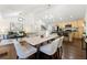 Spacious dining room with hardwood floors, and neutral colors that opens to the living room and kitchen at 2133 Trailwood Rd, Decatur, GA 30032