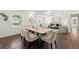 Spacious dining room with hardwood floors, neutral colors, and decorative lighting with a view of the living area at 2133 Trailwood Rd, Decatur, GA 30032