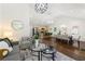 Spacious open-concept living area that flows into the kitchen, with neutral colors and hardwood floors at 2133 Trailwood Rd, Decatur, GA 30032
