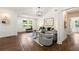 Bright living room with hardwood floors, neutral decor, and high ceiling with many windows allowing natural light at 2133 Trailwood Rd, Decatur, GA 30032