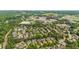 Enjoy the beauty of this established neighborhood with mature trees in an aerial view at 2700 Vinings Orchard Cir, Atlanta, GA 30339