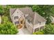 An aerial view shows the home's attractive architectural details, landscaping, and large driveway at 2700 Vinings Orchard Cir, Atlanta, GA 30339