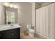 Bathroom featuring a dark vanity, shower/tub, and neutral wall color at 2700 Vinings Orchard Cir, Atlanta, GA 30339