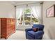 Bedroom with a large window and a cozy chair at 2700 Vinings Orchard Cir, Atlanta, GA 30339