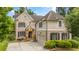 A beautiful two-story brick and siding home features a well-manicured lawn and a two-car garage at 2700 Vinings Orchard Cir, Atlanta, GA 30339