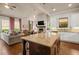 Open concept kitchen and living area with hardwood floors and recessed lighting at 2700 Vinings Orchard Cir, Atlanta, GA 30339