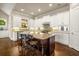 Kitchen with white cabinets, granite counters and island with seating at 2700 Vinings Orchard Cir, Atlanta, GA 30339
