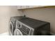 Laundry room with stacked, front-load washer and dryer at 2700 Vinings Orchard Cir, Atlanta, GA 30339