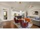 Living room flowing into a kitchen with hardwood floors, stainless steel appliances and seating at 2700 Vinings Orchard Cir, Atlanta, GA 30339
