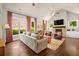 Bright living room with vaulted ceiling, fireplace, hardwood floors and large windows at 2700 Vinings Orchard Cir, Atlanta, GA 30339