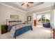 Spacious main bedroom features a trey ceiling, neutral colors, and a sitting area with views of the private backyard at 2700 Vinings Orchard Cir, Atlanta, GA 30339