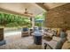 Covered patio with a fireplace and view of the backyard pool at 2700 Vinings Orchard Cir, Atlanta, GA 30339