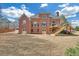 Brick home with spacious backyard, walkout basement, and a wooden deck perfect for outdoor entertainment at 2740 Heritage Bend Sw Ct, Grayson, GA 30017