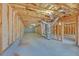 Unfinished basement with exposed insulation, wooden frame, and concrete flooring at 2740 Heritage Bend Sw Ct, Grayson, GA 30017