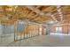 Spacious unfinished basement with exposed ceiling, studs, and concrete floor offering potential for customization at 2740 Heritage Bend Sw Ct, Grayson, GA 30017
