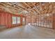 Unfinished basement featuring open layout, insulated walls, natural light, and a walkout door at 2740 Heritage Bend Sw Ct, Grayson, GA 30017