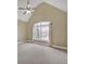 Bedroom featuring a large arched window providing lots of light and a ceiling fan at 2740 Heritage Bend Sw Ct, Grayson, GA 30017