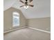 A simple bedroom with neutral walls, carpet, a ceiling fan, and a window with natural light at 2740 Heritage Bend Sw Ct, Grayson, GA 30017