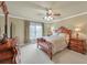 Bedroom with traditional furniture, including a dresser and bedside tables at 2740 Heritage Bend Sw Ct, Grayson, GA 30017