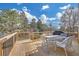 Outdoor deck with dining table and chairs overlooking the yard and trees at 2740 Heritage Bend Sw Ct, Grayson, GA 30017