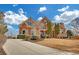 Lovely brick home with well-kept lawn, mature trees, and a long driveway at 2740 Heritage Bend Sw Ct, Grayson, GA 30017