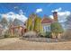 Beautiful brick home showcasing manicured shrubs, trees, and detailed architectural elements at 2740 Heritage Bend Sw Ct, Grayson, GA 30017