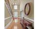 Stately foyer boasting hardwood floors, a staircase, and a sophisticated chandelier at 2740 Heritage Bend Sw Ct, Grayson, GA 30017