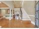 Grand foyer with hardwood floors, staircase, high ceilings, and classic architectural details at 2740 Heritage Bend Sw Ct, Grayson, GA 30017