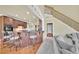 A kitchen island with seating provides views of the kitchen, stairs, and living room at 2740 Heritage Bend Sw Ct, Grayson, GA 30017