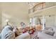 Bright living room with hardwood floors, large windows, a rug, and two-story ceiling at 2740 Heritage Bend Sw Ct, Grayson, GA 30017