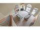 Living room aerial view featuring neutral sofas, stone fireplace, and large windows at 2740 Heritage Bend Sw Ct, Grayson, GA 30017