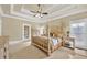 Large main bedroom featuring neutral walls, carpet flooring, and a four-poster bed at 2740 Heritage Bend Sw Ct, Grayson, GA 30017