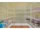 A well-organized pantry features white wire shelving and wood floors at 2740 Heritage Bend Sw Ct, Grayson, GA 30017