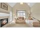 Cozy sitting room with a fireplace, a vaulted ceiling, and natural light at 2740 Heritage Bend Sw Ct, Grayson, GA 30017