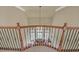 View from the top of the staircase showcasing detailed railing work at 2740 Heritage Bend Sw Ct, Grayson, GA 30017