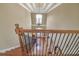 View from the top of staircase featuring detailed railing work and hardwood flooring at 2740 Heritage Bend Sw Ct, Grayson, GA 30017