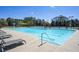 Sparkling community swimming pool with lounge chairs, perfect for relaxation and recreation at 2740 Heritage Bend Sw Ct, Grayson, GA 30017