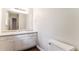 Clean bathroom featuring white cabinets, granite counters, large mirror and updated fixtures at 4820 Oak Grove Dr, Cumming, GA 30040