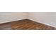 Bright, empty bedroom features beautiful wood-look floors and a large window at 4820 Oak Grove Dr, Cumming, GA 30040